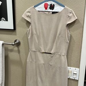 Beautiful elegant tan, cap sleeves and gold metal detail at waist.